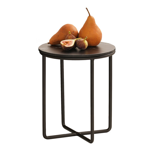 A small round black metal table with a wire frame base, topped with two pears and two figs.