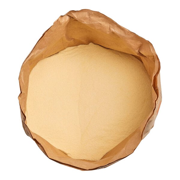 A large brown paper bag filled with a fine, light yellow powder.