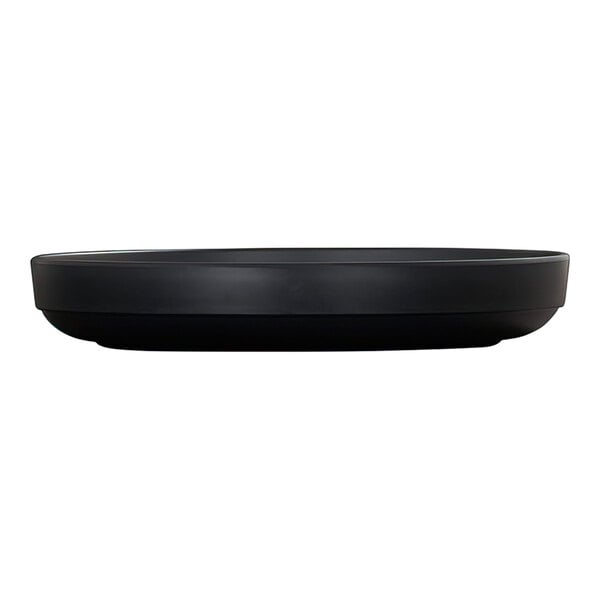 A black, round plate with a raised rim, shown from a side view against a white background.