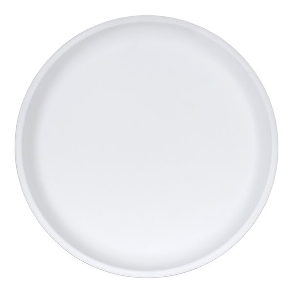 A plain white round plate with a slightly raised rim, viewed from above.