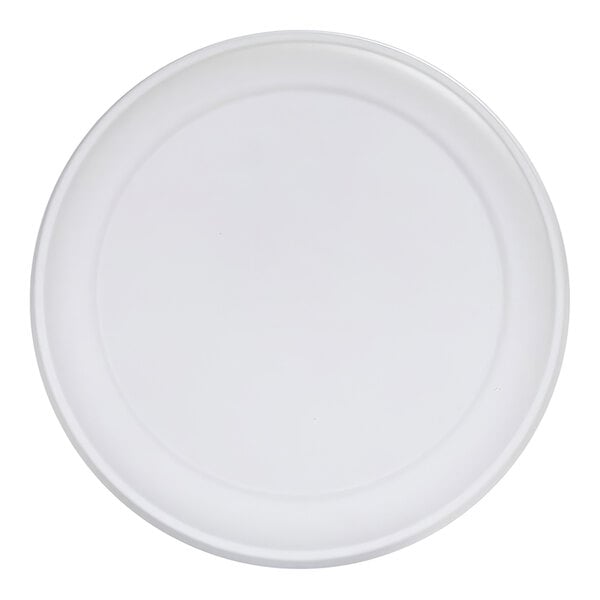 A plain white round plate with a slightly raised rim, viewed from above.