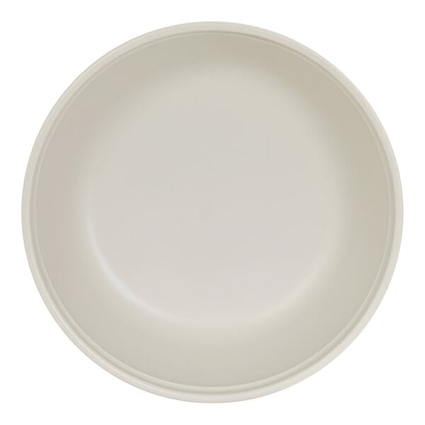 A top-down view of a plain, round, ivory-colored bowl with smooth sides.