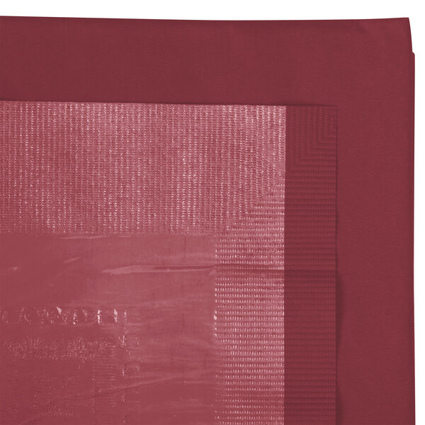 A red table cover with a white square edge.