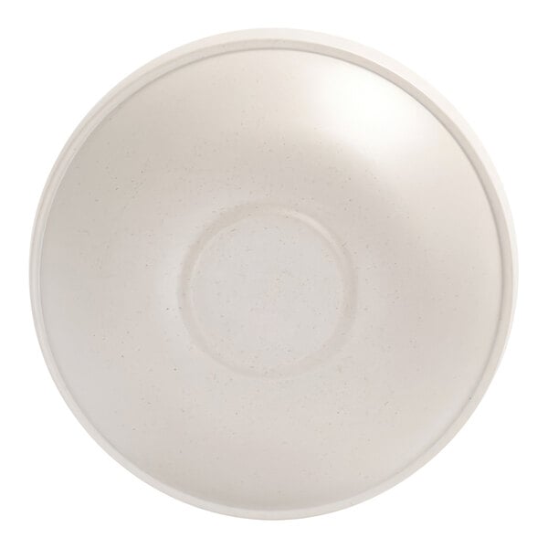 A top-down view of a plain, round, ivory-colored bowl with a subtle speckled pattern.