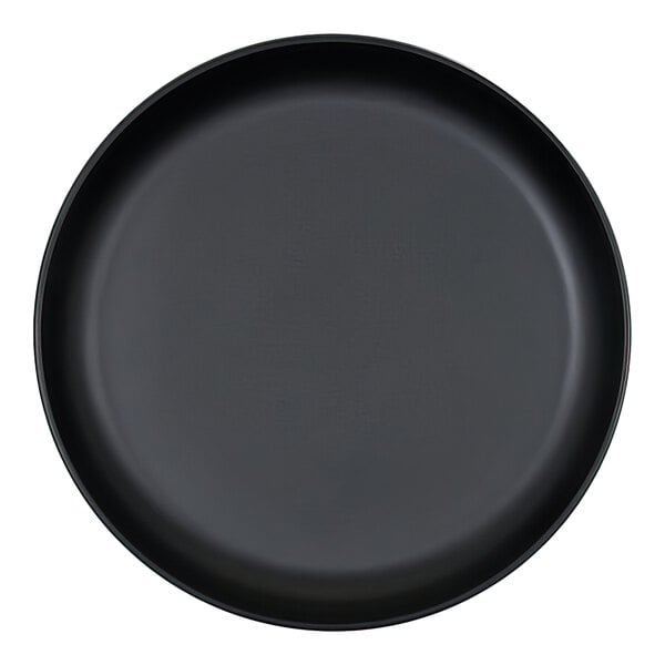 A round, black platter with a raised rim, viewed from above.