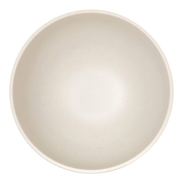 A top-down view of a plain, round, ivory-colored bowl with a smooth, slightly speckled surface.