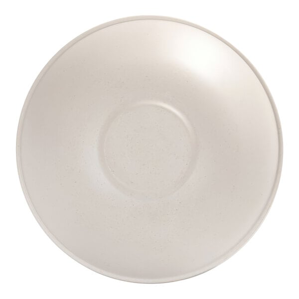 A round, ivory-colored bowl with a subtle speckled pattern viewed from above.