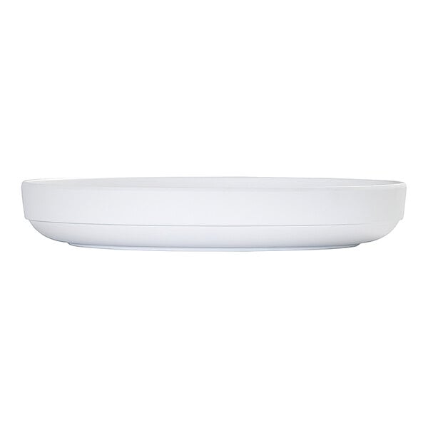 A white, round plate with a raised rim, shown from a side view against a plain background.