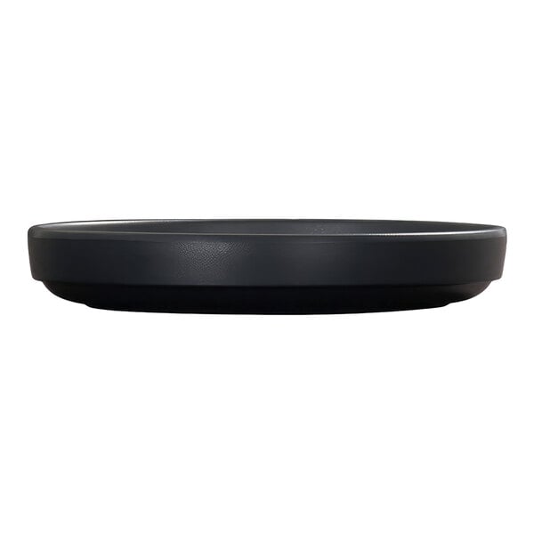 A black, round plate with a raised rim, shown from a side view against a white background.