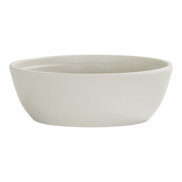 A plain, round, ivory-colored bowl with smooth sides and a slightly flared rim.