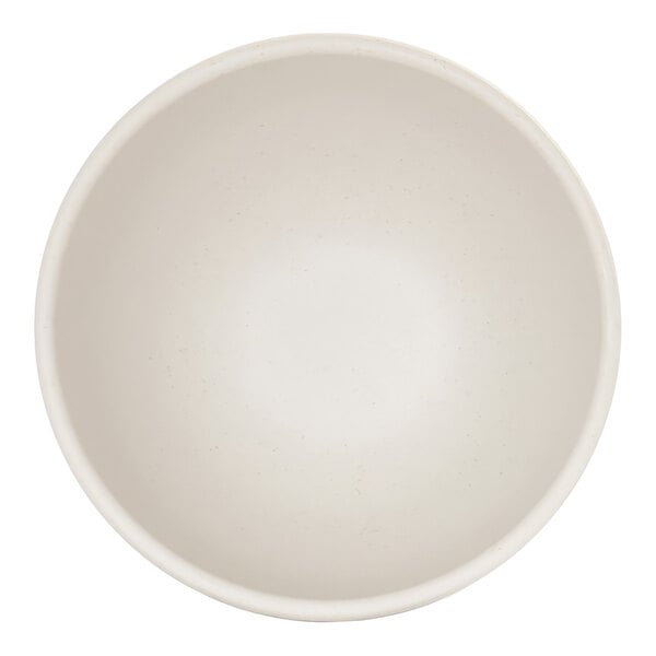 A top-down view of a plain, round, ivory-colored bowl with a smooth surface.