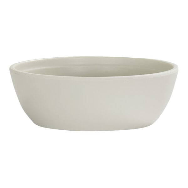 A plain, round, ivory-colored bowl with smooth sides and a slightly flared rim.