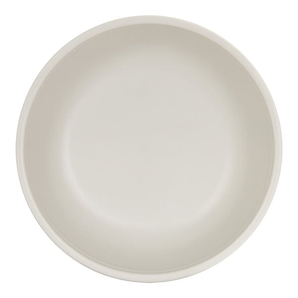 A plain, round, ivory-colored bowl viewed from above.