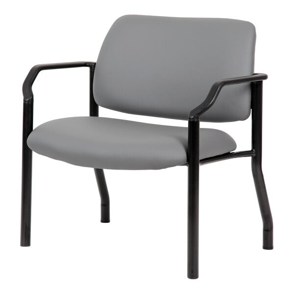 A gray chair with a cushioned seat and backrest, black metal frame, and armrests.