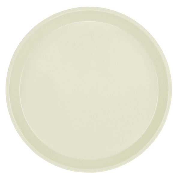 A white plate with a round rim.