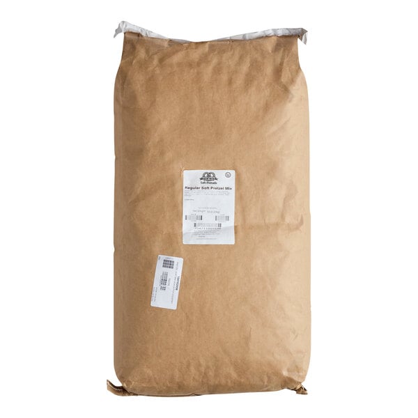 A large brown paper bag with a white label and barcode on the front.