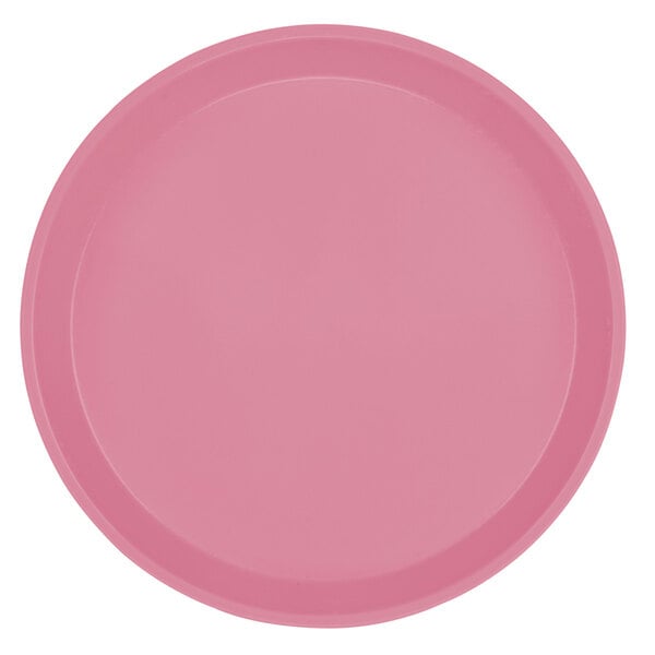 A close-up of a pink Cambro round fiberglass tray.