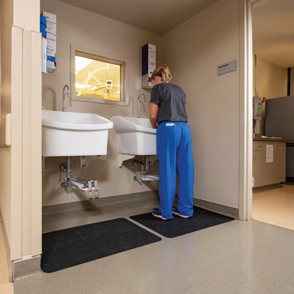 New Pig Grippy GRP7007-BK 2' x 2 15/16' Black Antimicrobial Sink / Dryer Mat with Adhesive Backing - 4/Case