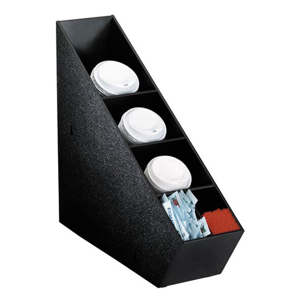 A black organizer with five angled compartments holding cup lids, condiment packets, and stirrers.