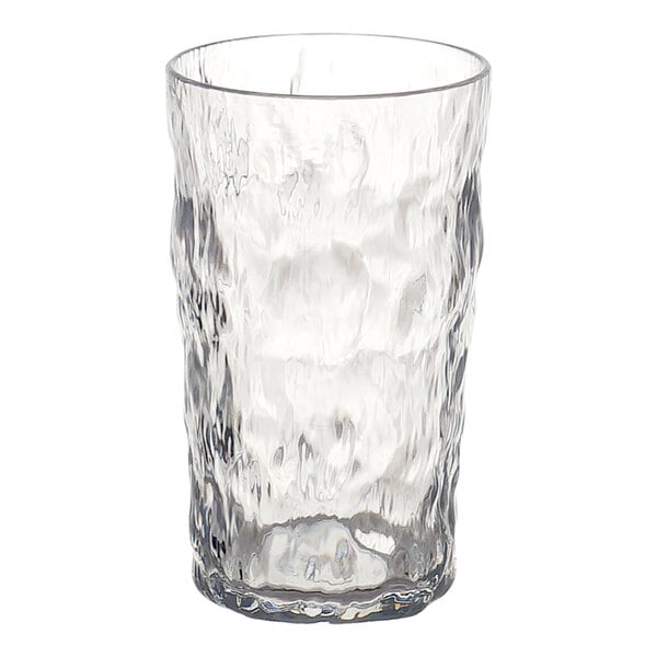 A clear tumbler with a textured, wavy surface design.