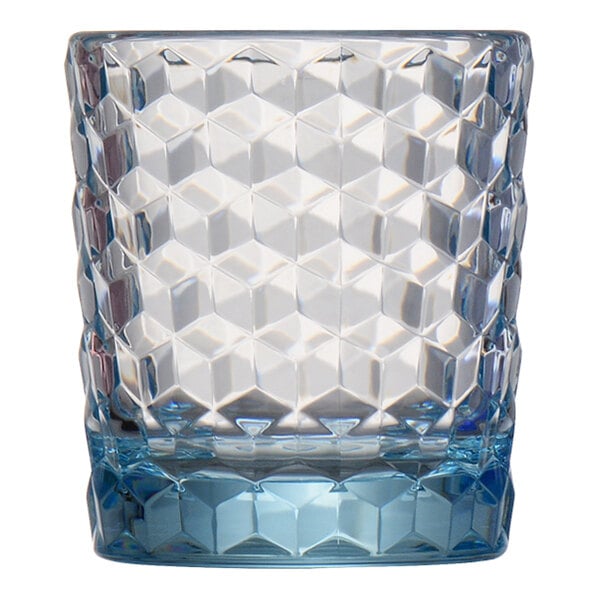 A faceted, light blue-tinted glass with a geometric pattern and a thick base.