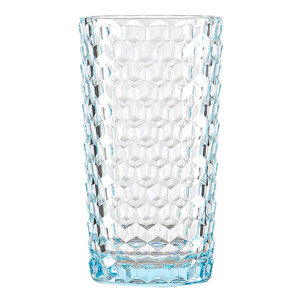 A clear, tall drinking glass with a textured, geometric pattern and a slight blue tint at the base.