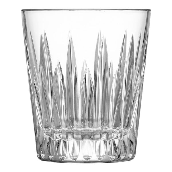 A clear glass with a faceted, cut-glass pattern and a thick base.