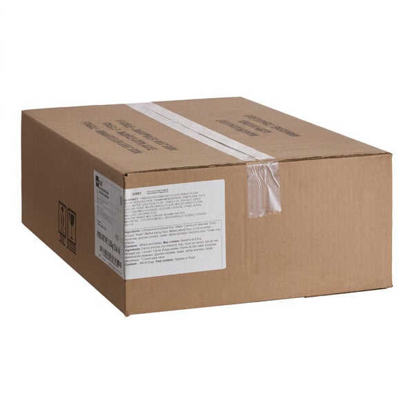 A sealed brown cardboard box with a white label and clear tape on top.