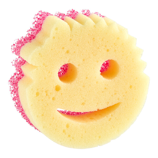 A round yellow sponge with a smiley face design and pink scrubbing material on the back.