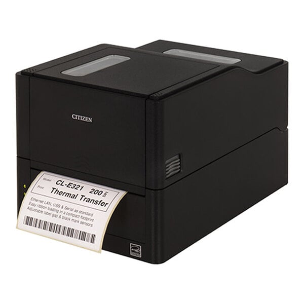 A black box-shaped printer is printing a barcode label from its front slot.
