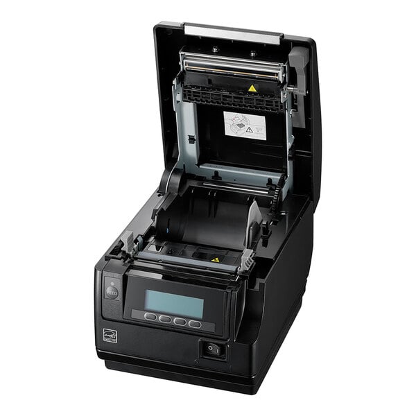A black electronic device with an open top cover, revealing internal components and a display screen with buttons on the front panel.