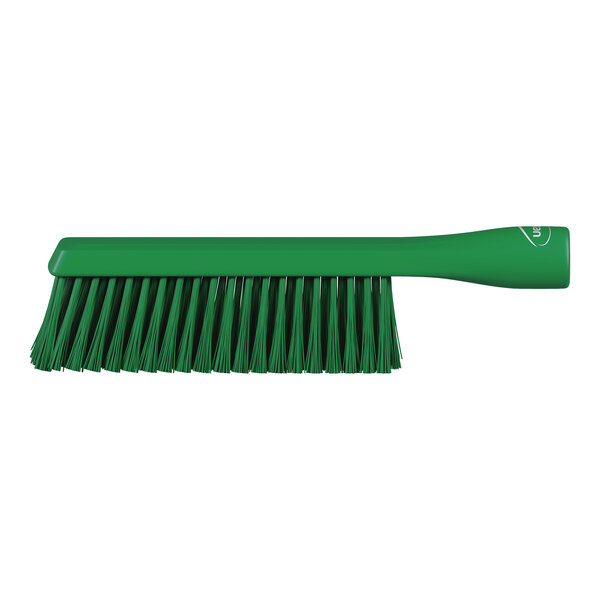 A green brush with a long handle and dense bristles, shown against a white background.
