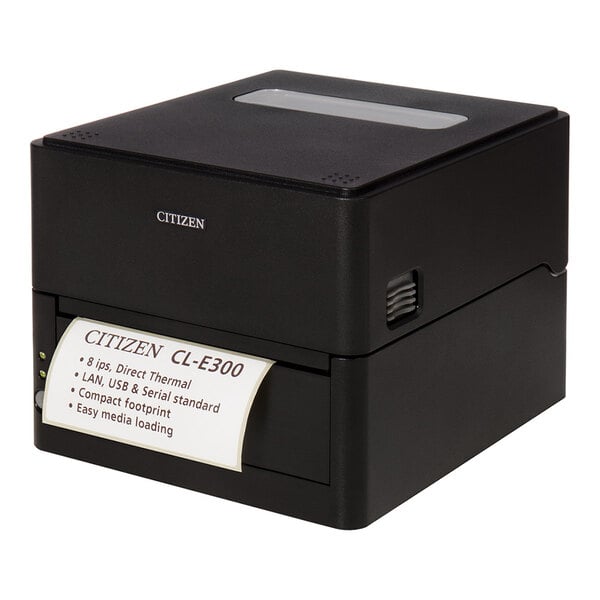 A black box-shaped printer with a visible printed label emerging from the front, displaying product information.