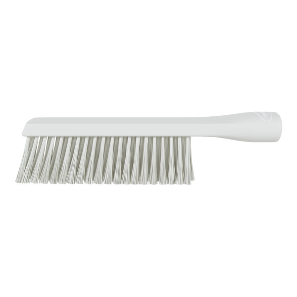 A white brush with a long handle and dual rows of bristles, shown in a side view against a white background.