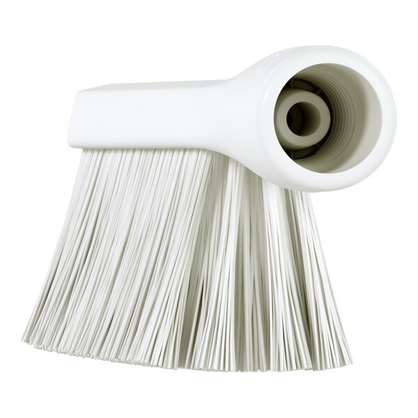 A white brush head with a threaded handle opening and densely packed bristles of varying stiffness.