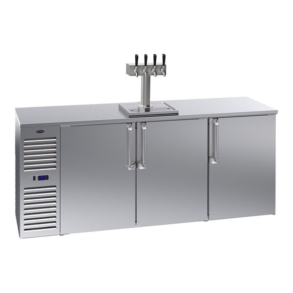A stainless steel commercial kegerator with three doors, a left-side compressor, and a quadruple beer tap on top.
