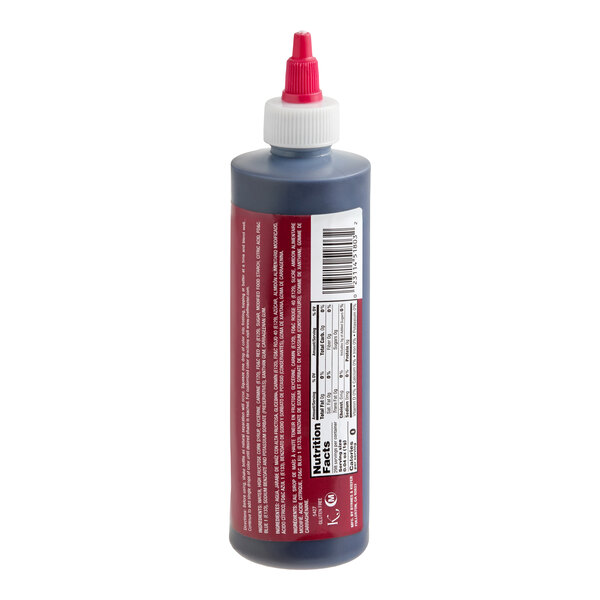 A plastic squeeze bottle with a red and white twist cap, containing a dark liquid and featuring a nutrition facts label and barcode on the side.