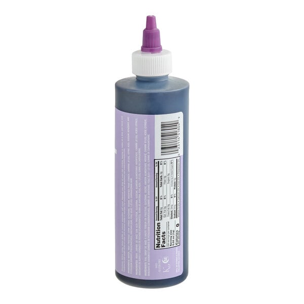 A plastic squeeze bottle with a purple liquid inside, featuring a white cap and a purple nozzle, and a nutrition facts label on the side.