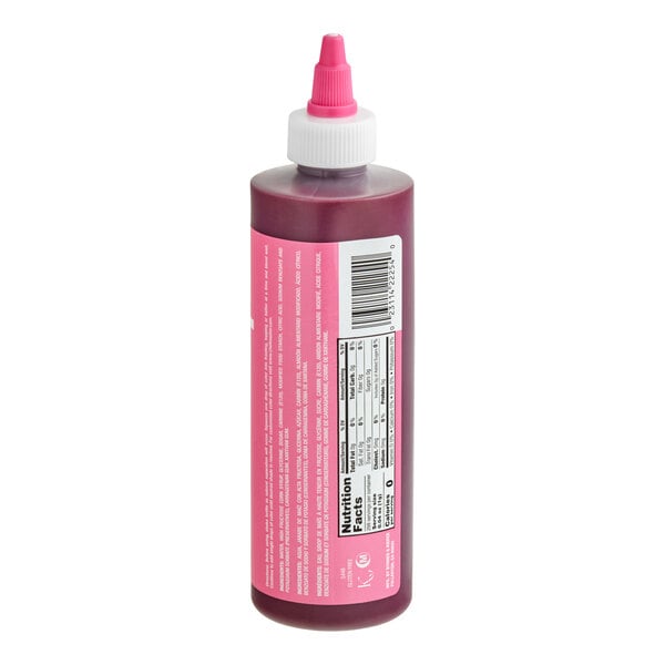 A plastic squeeze bottle with a pink label and a pink-tipped nozzle, containing a dark purple liquid.