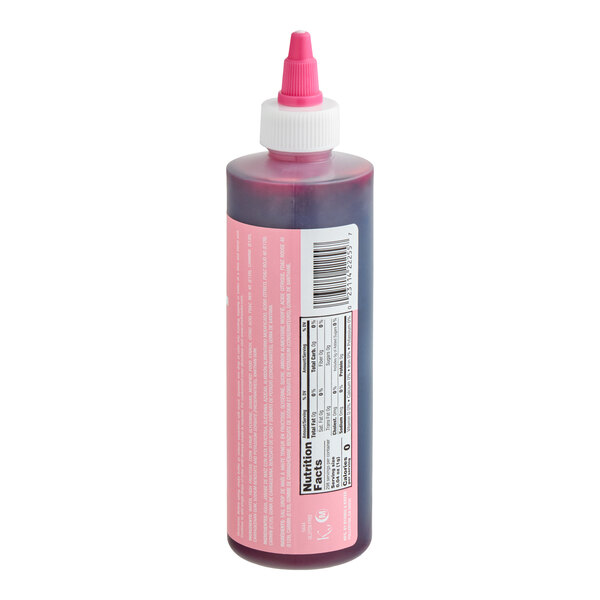 A plastic squeeze bottle with a pink liquid inside, featuring a white and pink twist cap and a nutrition facts label on the side.