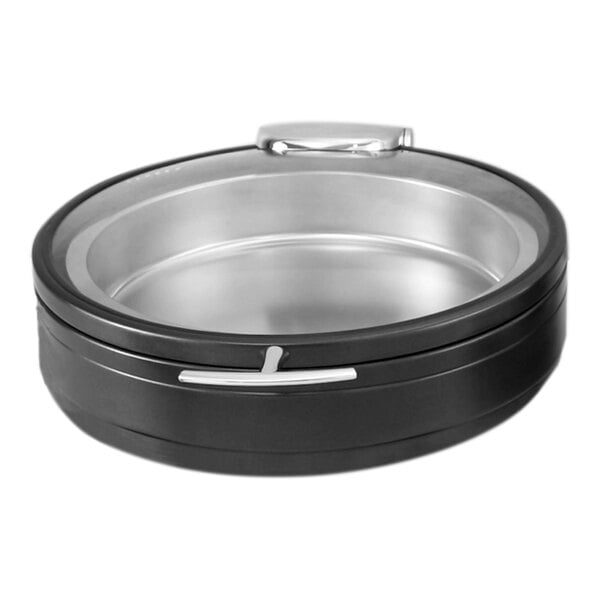 A round, black and silver stainless steel container with a glass lid and metallic accents.