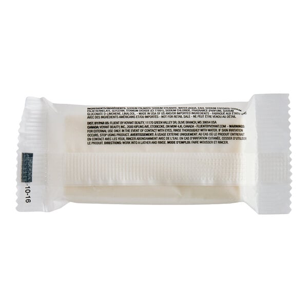 A small, individually wrapped bar of soap in white packaging with printed text on the back.