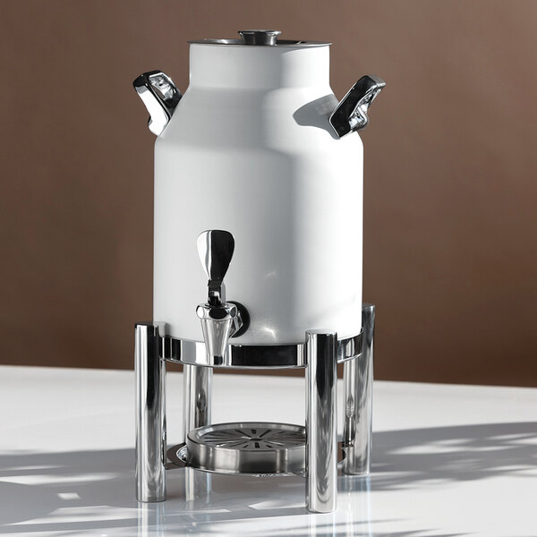 A white, stainless steel vacuum-insulated beverage urn with a spigot, two side handles, and a metal stand.