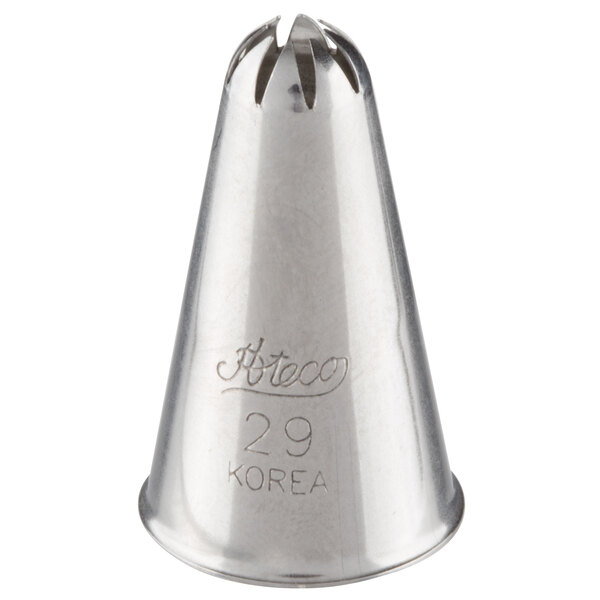A metal piping tip with a closed star-shaped opening and engraved text on the side.