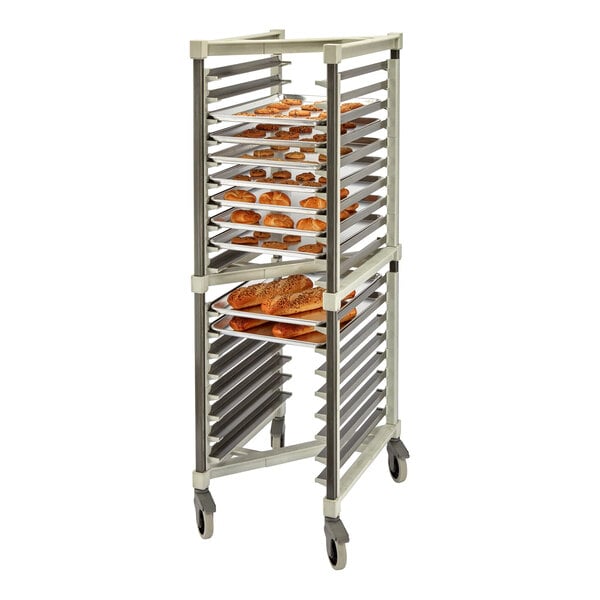 A tall, wheeled rack holding multiple trays of baked goods such as bread and pastries.