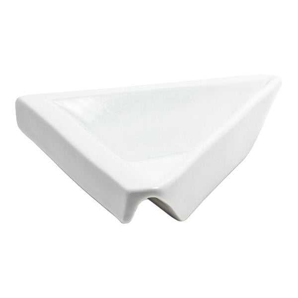 A small, deep, white triangular porcelain dish with a modern design.