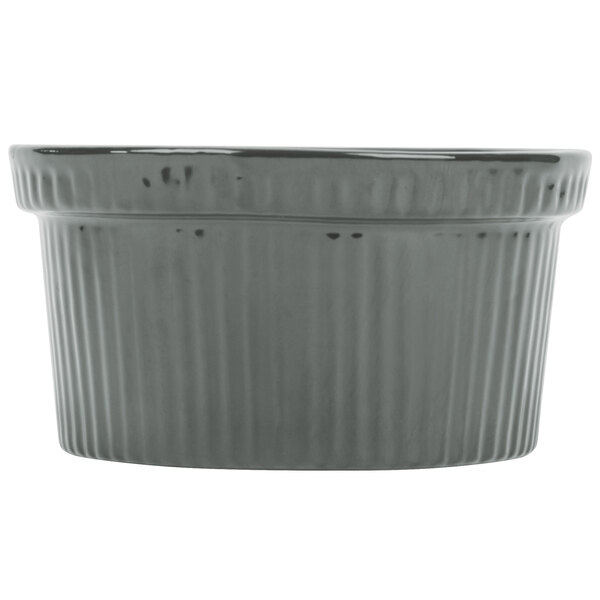 A grey Tablecraft cast aluminum souffle bowl with ridges.