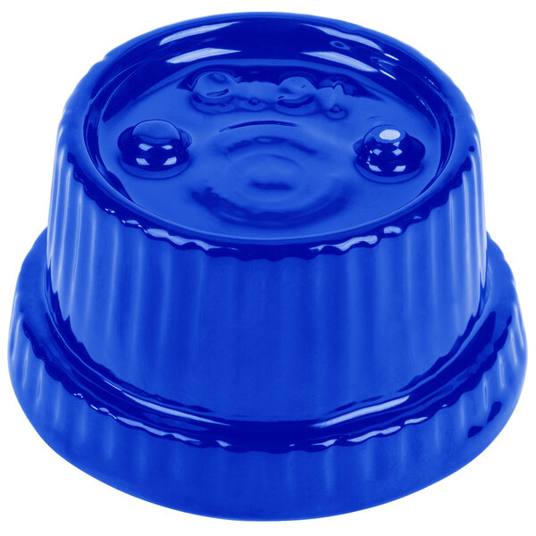 A Tablecraft cobalt blue cast aluminum souffle bowl with ridges with a blue plastic cap.