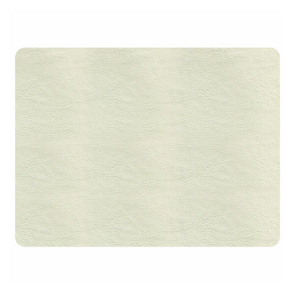 A close-up view of a rectangular, light beige vinyl-like surface with a subtle textured pattern and rounded corners.