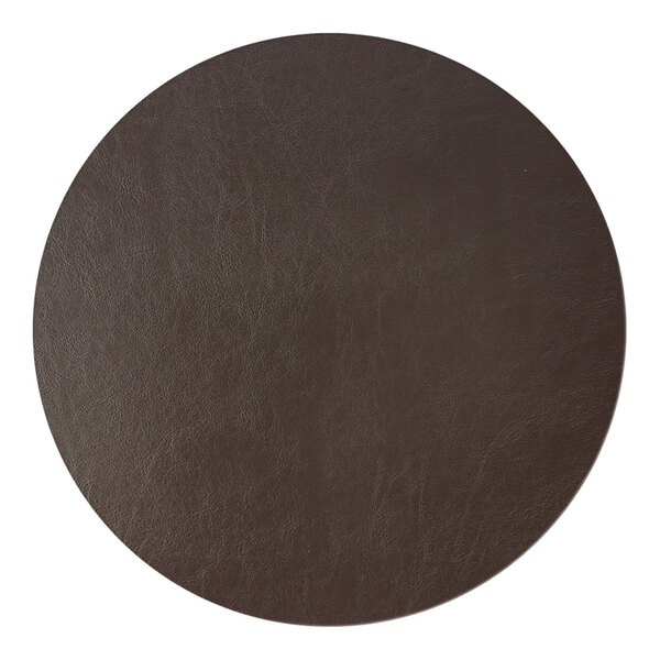 A close-up view of a round, dark brown, leather-like textured surface.
